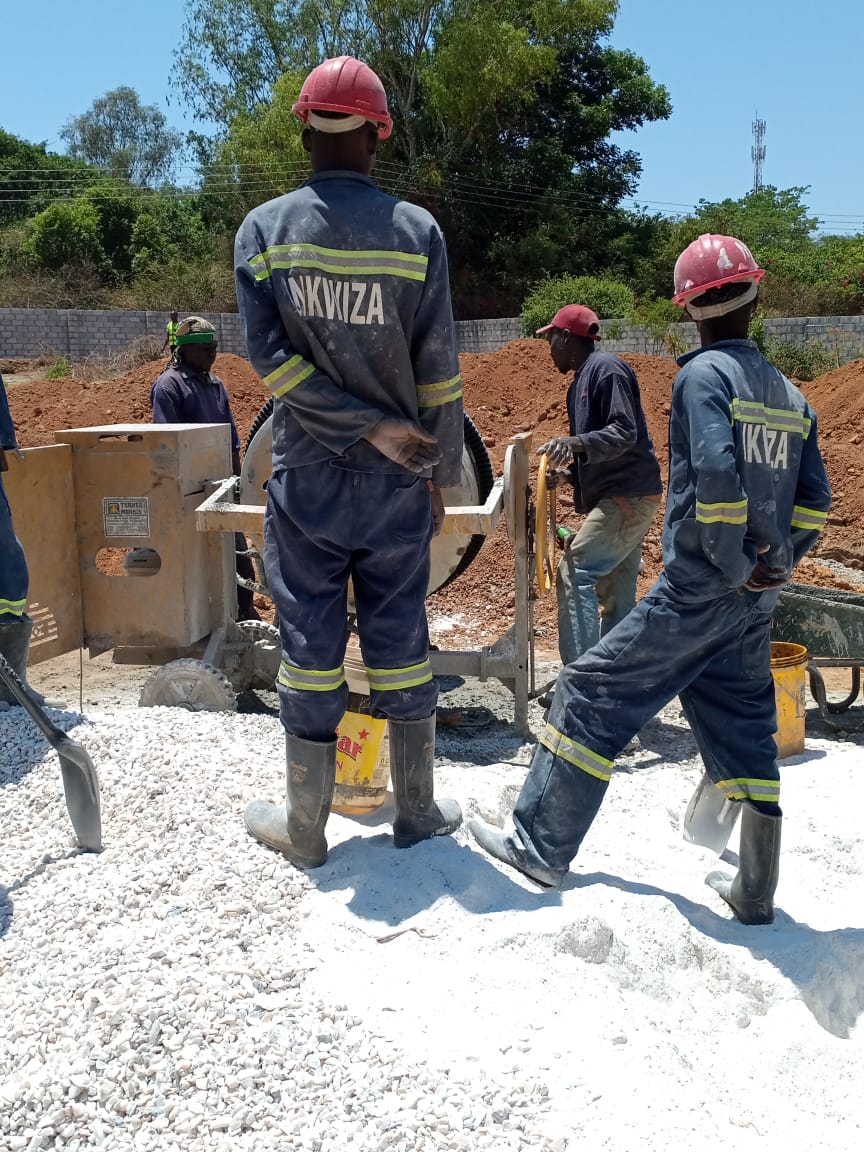 Workers building a house